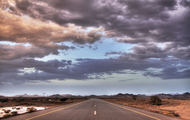 Clouds over a road in Oman