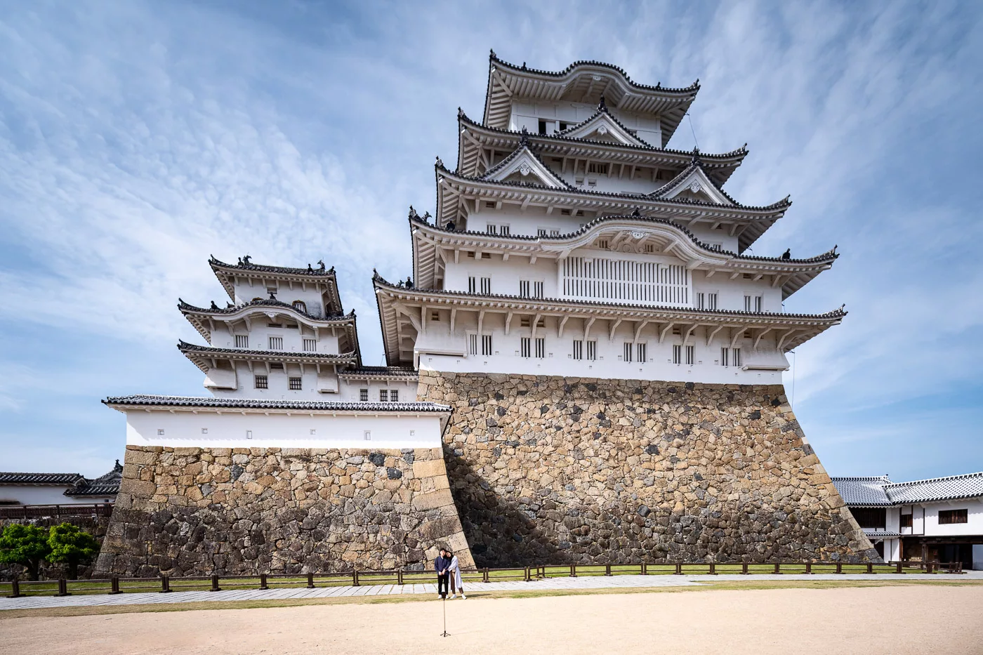 A couple posing in front of the Himeji Castle, Japan